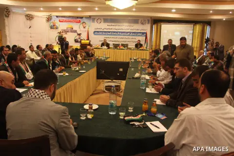 Palestinian attend a conference of the Islamic radios union, in Gaza city, on May 25, 2014. Photo by Mohammed Asad