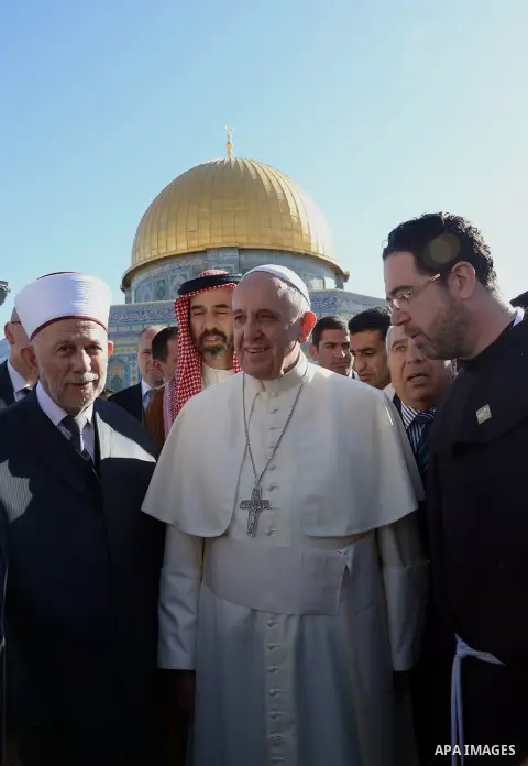 Pope Francis walks in front of the Dome of the Rock as he visits the Al-Aqsa Mosque compound, in Jerusalem's Old City on May 25, 2014. In his first Middle East tour since his anointment in 2013, Pope Francis held a histo...