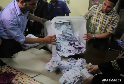 Egyptian election workers count ballots at the end of the third day of voting in the presidential elections, at a polling station in Cairo, Egypt, 28 May 2014. Polling stations opened on 28 May for the final day of the v...