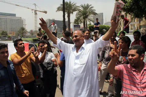 Egyptian supporters of Abdel Fattah al-Sisi celebrate at Tahrir square in Cairo May 29, 2014. Initial poll count on Wednesday showed that Egypt's former military chief Abdel Fattah al-Sisi would get a landslide victory i...