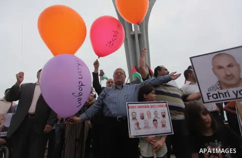 Palestinians hold balloons during a rally on the fourth anniversary of the Mavi Marmara Gaza flotilla incident, at the seaport of Gaza City May 31, 2014. Eight Turks and a Turkish-American, died in an Israeli commando ra...