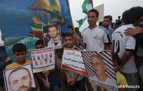 Palestinians take part a rally on the fourth anniversary of the Mavi Marmara Gaza flotilla incident, at the seaport of Gaza City May 31, 2014. Eight Turks and a Turkish-American, died in an Israeli commando raid on the M...