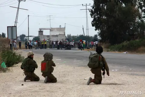 Israeli soldiers fire tear gas at Palestinian protesters responding with stones during clashes near the West Bank city of Tulkarem, 31 May 2014. Reportedly dozens of Palestinians were injured during clashes with Israeli...