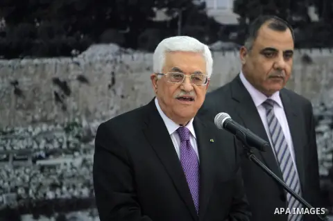 Palestinian President Mahmoud Abbas receives the Palestinian national football team which won the AFC Challenge Cup, at Abbas's office in the West Bank city of Ramallah on June 1, 2014. Palestine qualified for their maid...