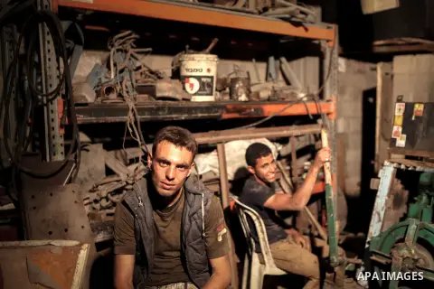 Palestinian workers drill water wells, in Gaza city, on June 01, 2014. The coastal aquifer, Gaza's main water source, has been continuously over-pumped for decades, even prior to Israel's occupation in 1967. Some 180 mil...