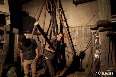 Palestinian workers drill water wells, in Gaza city, on June 01, 2014. The coastal aquifer, Gaza's main water source, has been continuously over-pumped for decades, even prior to Israel's occupation in 1967. Some 180 mil...