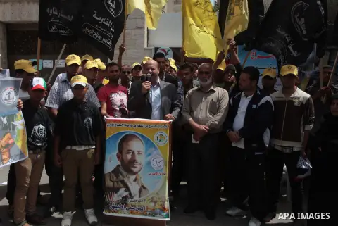 Palestinians take part a protest to solidarity with Palestinian prisoners held in Israeli jails, in front of Red cross office Gaza city, on June 03, 2014. It was about 120 Palestinians imprisoned without trial in Israel...