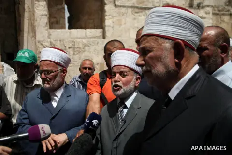 Palestinian members of Supreme Islamic Council hold a press conference, outside the al-Aqsa mosque compound, in Jerusalem's Old City on June 03, 2014. The Supreme Islamic Council represent the Israeli violations against...
