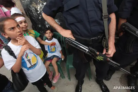 Palestinians take part a protest to solidarity with Palestinian prisoners held in Israeli jails, in Gaza city June 04, 2014. About 120 Palestinians imprisoned without trial in Israel on an open hunger strike, and only sa...