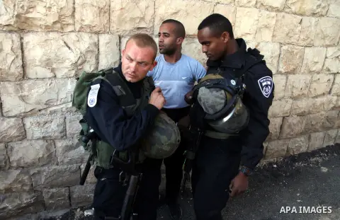 Israeli policemen arrest a Palestinian man joined a demonstration to mark Naksa Day (setback), in Jerusalem on June 05, 2014. Palestinians mark "Naksa Day" to mourn the 47th anniversary of Israel's occupation of the West...