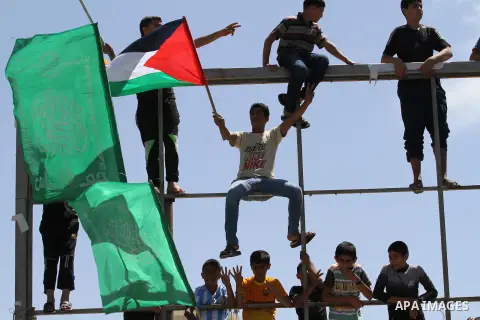 Palestinians take part in a rally in solidarity with prisoners on hunger strike, and the global alliance for the support of Al-Quds (Jerusalem) outside Red Cross office in Gaza City on June 6, 2014. Some 120 Palestinians...