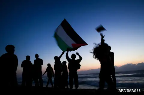 Palestinians children enjoy a summer day at the beach in Gaza city, on June 6, 2014. Friday is the Muslim holiday and as summer is entering many Palestinian people go to the beach since it is the major entertainment area...