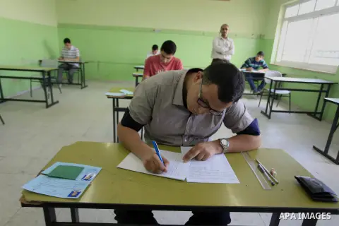 Palestinian male students sit for their final high school exams, known as "Tawjihi", in the West Bank city of Ramallah on June 7, 2014. More than 85,000 high school students from the West Bank, including East Jerusalem,...