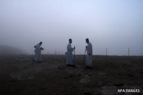 Members of the Samaritan community pray atop Mount Gerizim, above the city of Nablus, West Bank, after sunrise on 08 June 2013, as they celebrate the Shavuot festival, marking the giving of the Torah at Mount Sinai seven...