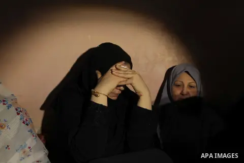 Palestinian relatives of fisherman Imad Salem mourn in his house during his funeral in Beit Lahiya town in the northern Gaza Strip, 08 June 2014. Salem, 51, who was injured two weeks earlier when Israeli navy fired at th...