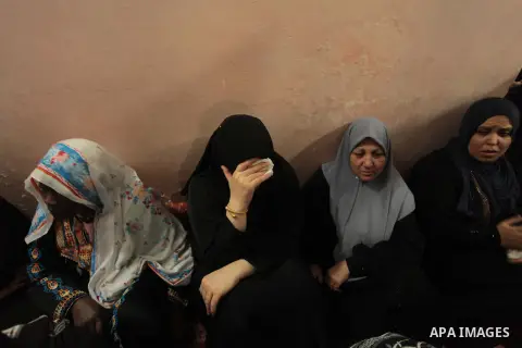 Palestinian relatives of fisherman Imad Salem mourn in his house during his funeral in Beit Lahiya town in the northern Gaza Strip, 08 June 2014. Salem, 51, who was injured two weeks earlier when Israeli navy fired at th...