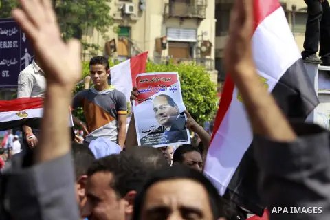 Egyptians celebrate upon the completion of the swearing-in ceremony by President elect Abdel Fattah al-Sissi, in Tahrir square, Cairo, Egypt, 08 June 2014. Former army chief Abdel Fattah al-Sissi was on 08 June, sworn in...