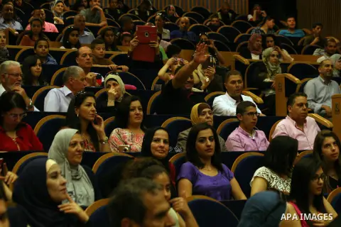 Palestinian students of the academy for the talented in Jerusalem during a graduation ceremony, in Jerusalem old city, on June 9, 2014. Photo by Saeed Qaq