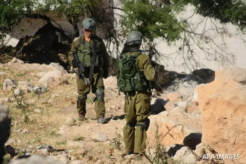 Israeli soldiers patrol in the West Bank City of Hebron, June 14, 2014. as they search for three teenagers who went missing near a West Bank settlement. The three, all students at a Jewish seminary, went missing late on...