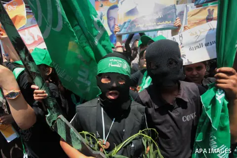 Palestinian children participate in a demonstration to celebrate after hearing the news of the kidnapping of the three Jewish youths who went missing in the West Bank Thursday night, in Gaza city on June 14, 2014. Fears...