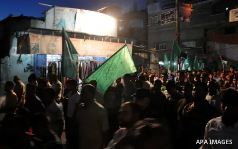 Palestinian supporters of Hamas movement take part in a demonstration against the Israeli airstrikes on the Gaza Strip and against arresting of Hamas members in the West Bank, in Jabalia in the northern Gaza Strip June 1...