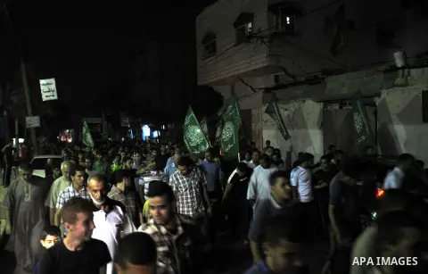 Palestinian supporters of Hamas movement take part in a demonstration against the Israeli airstrikes on the Gaza Strip and against arresting of Hamas members in the West Bank, in Jabalia in the northern Gaza Strip June 1...