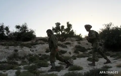 Israeli troops take part in a search operation on the outskirts of the West Bank town of Hebron on June 16,2014 as security forces broadened the search for three teenagers believed kidnapped by Palestinian militants and...