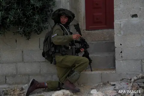 Israeli troops take part in a search operation for three Israeli teenagers believed kidnapped by Palestinian militants on June 21,2014 in the village of Beit Kahil near the West Bank city of Hebron. Israeli soldiers kill...