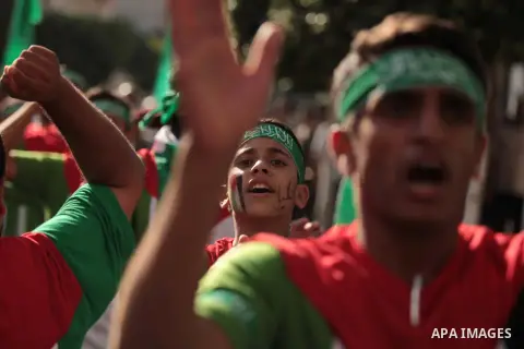 Palestinian children chant during a rally in solidarity with the hunger-striking Palestinian prisoners held by Israel, in Jabalia refugee camp in the northern Gaza Strip, June 24, 2014. Nearly 300 Palestinian prisoners h...