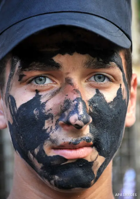 A Palestinian boy poses during a rally in solidarity with prisoners in Israeli jails and against the Israeli search operation for three missing Israeli teenagers in the West Bank, in Gaza City on June 25, 2014. Israeli P...