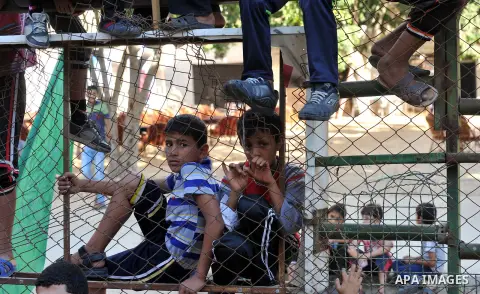 Palestinian children take part in a rally in solidarity with prisoners in Israeli jails and against the Israeli search operation for three missing Israeli teenagers in the West Bank, in Gaza City on June 25, 2014. Israel...
