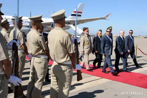 A handout photo made available by the Egyptian Presidency shows Egyptian President Abdel Fattah al-Sissi reviewing honor guard upon his arrival at Houari-Boumediene International Airport, in Algiers, Algeria, 25 June 201...
