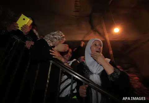 Palestinian relatives of Mostafa Aslan, 24 mourn during his funeral in the West Bank city of Ramallah on June 25, 2014. was pronounced dead from wounds he sustained during clashes with Israeli soldiers in Qalandiya refug...