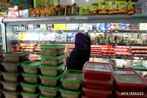 Palestinians shop at a market in preparation for the holy month of Ramadan in the West Bank City of Nablus, on June 26, 2013, ahead of the Muslim holy fasting month. Photo by Nedal Eshtayah