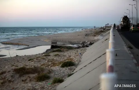 The sewage water is seen pour in the sea on the beach in the central Gaza Strip June 26, 2014. Palestinian Environment Quality Authority said in a statement the pollution of the seawater has gone beyond 50 percent. The l...