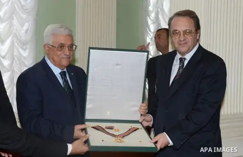 Palestinian President Mahmoud Abbas receives a honorary degree in Russian Diplomatic Academy in Moscow, on June 26, 2014. Abbas is on a visit to Russia. Photo by Thaer Ganaim