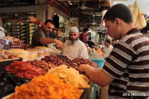 A Palestinian man sells spices in her shop at a market in Gaza City, as Muslims prepare for the upcoming holy fasting month of Ramadan, on June 28, 2014. on the eve of the start of the Muslim holy month of Ramadan. Durin...