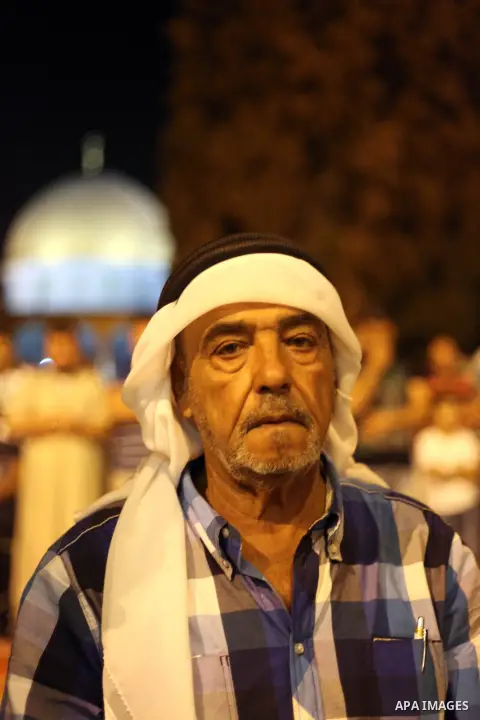 Palestinian Muslims pray al-Taraweeh prayer in front of the Dome of the Rock at the Al-Aqsa mosque compound in the old city of Jerusalem on June 28, 2014. Muslim believers abstain from eating, drinking, smoking and havin...