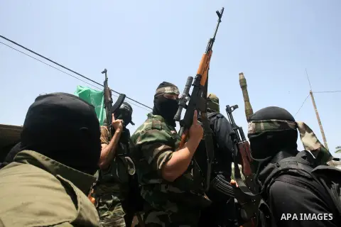Palestinian members of Hamas' armed wing attend the funeral of their comrade Mohammed Ebeid in Deir El-Balah in the central Gaza Strip June 30, 2014. Israeli forces attacked militant targets in the Gaza Strip on Sunday,...