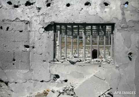 A Palestinian man inspects damages following an overnight Israeli air strike in Khan Younis in the southern Gaza Strip July 3, 2014. Israel struck over 15 Hamas targets in Gaza overnight in response to constant rocket fi...