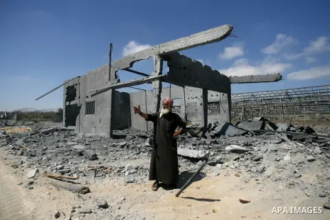 A Palestinian man inspects damages following an overnight Israeli air strike in Khan Younis in the southern Gaza Strip July 3, 2014. Israel struck over 15 Hamas targets in Gaza overnight in response to constant rocket fi...
