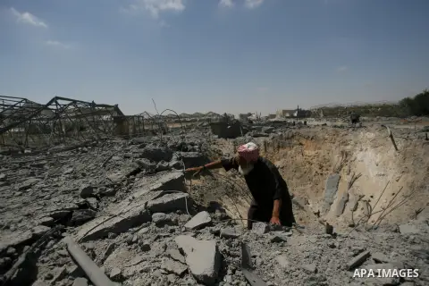A Palestinian man inspects a crater damaged by following an overnight Israeli air strike in Khan Younis in the southern Gaza Strip July 3, 2014. Israel struck over 15 Hamas targets in Gaza overnight in response to consta...
