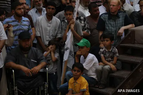 Palestinian supporters of Hamas movement take part in a rally in solidarity with the Palestinian in the West Bank and against any possible Israeli attack on Gaza, in Jabalia in the northern Gaza Strip, July 04, 2014. The...