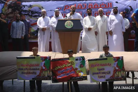 Palestinian supporters of Hamas movement take part in a rally in solidarity with the Palestinian in the West Bank and against any possible Israeli attack on Gaza, in Jabalia in the northern Gaza Strip, July 04, 2014. The...