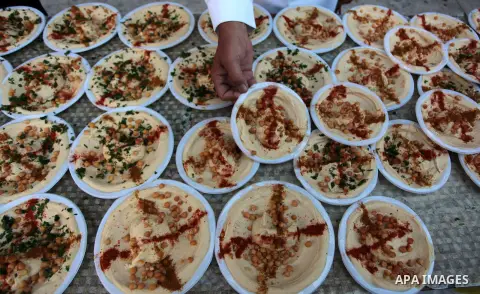 Palestinians prepare chickpeas known as hummus for breakfasting during the holy fasting month of Ramadan in Gaza city, on July 04, 2014. Muslims around the world refrain from eating, drinking and sexual intercourse from...