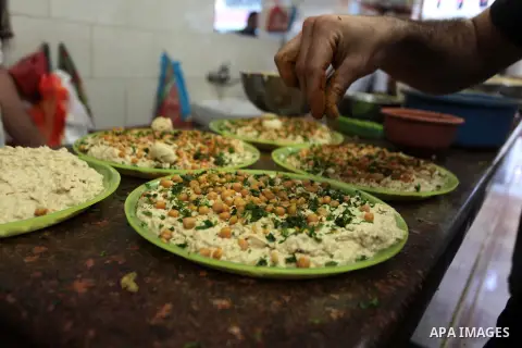 Palestinians prepare chickpeas known as hummus for breakfasting during the holy fasting month of Ramadan in Gaza city, on July 04, 2014. Muslims around the world refrain from eating, drinking and sexual intercourse from...