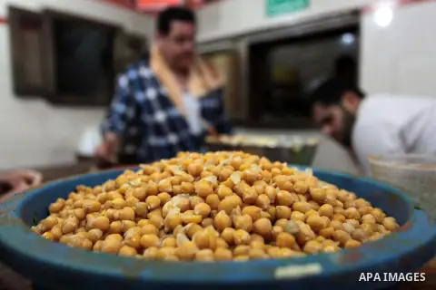 Palestinians prepare chickpeas known as hummus for breakfasting during the holy fasting month of Ramadan in Gaza city, on July 04, 2014. Muslims around the world refrain from eating, drinking and sexual intercourse from...