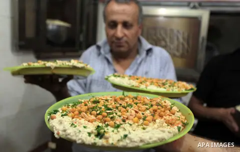 Palestinians prepare chickpeas known as hummus for breakfasting during the holy fasting month of Ramadan in Gaza city, on July 04, 2014. Muslims around the world refrain from eating, drinking and sexual intercourse from...