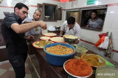 Palestinians prepare chickpeas known as hummus for breakfasting during the holy fasting month of Ramadan in Gaza city, on July 04, 2014. Muslims around the world refrain from eating, drinking and sexual intercourse from...
