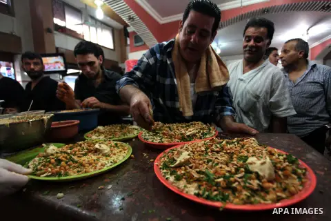 Palestinians prepare chickpeas known as hummus for breakfasting during the holy fasting month of Ramadan in Gaza city, on July 04, 2014. Muslims around the world refrain from eating, drinking and sexual intercourse from...